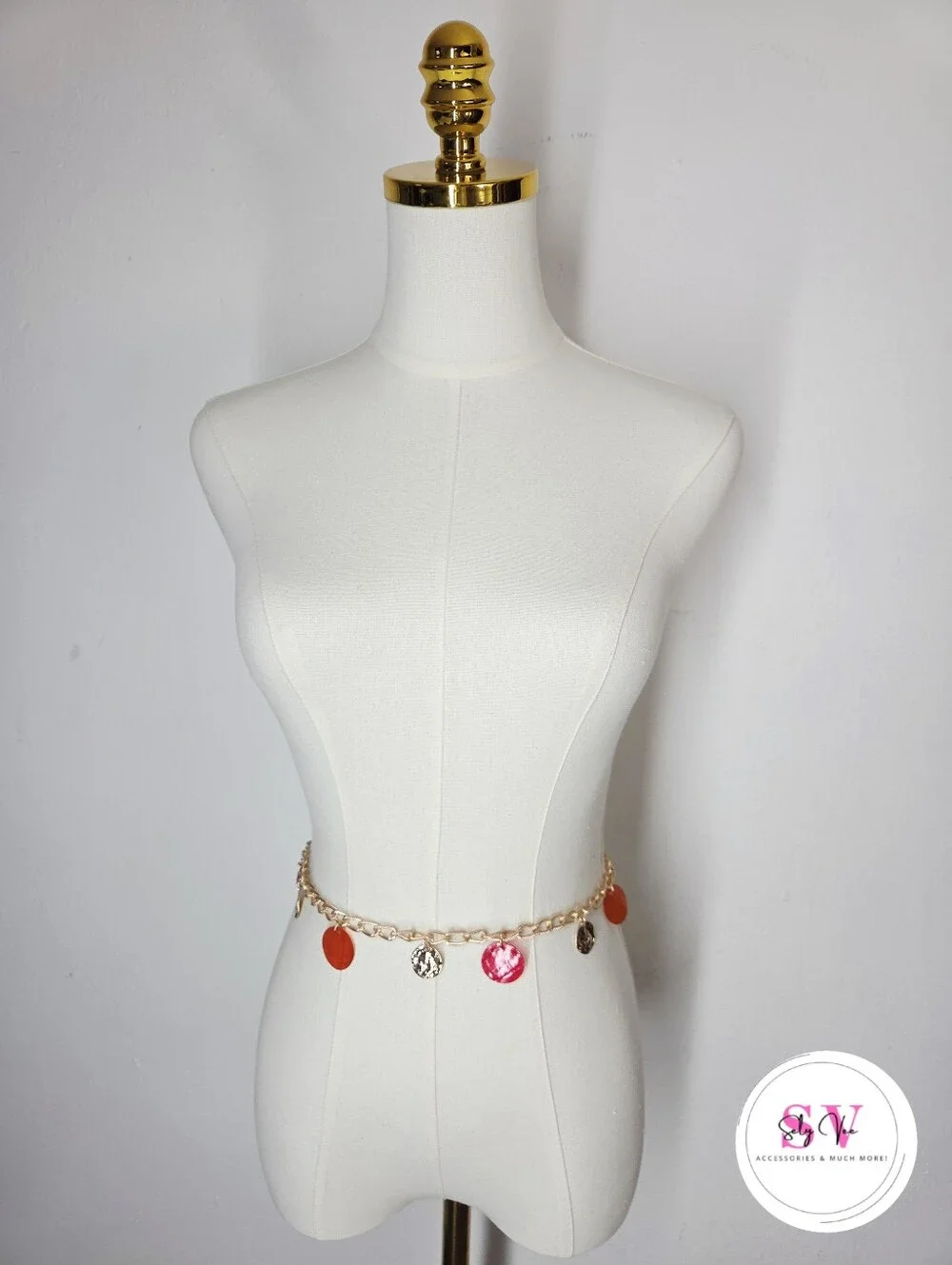 Gold chain belt with red and orange circular charms
